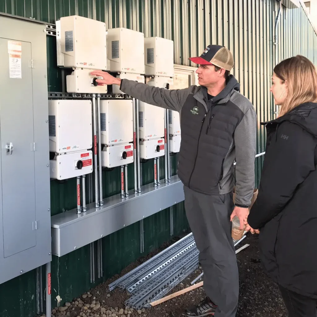 Green Ridge Solar technician servicing a solar inverter